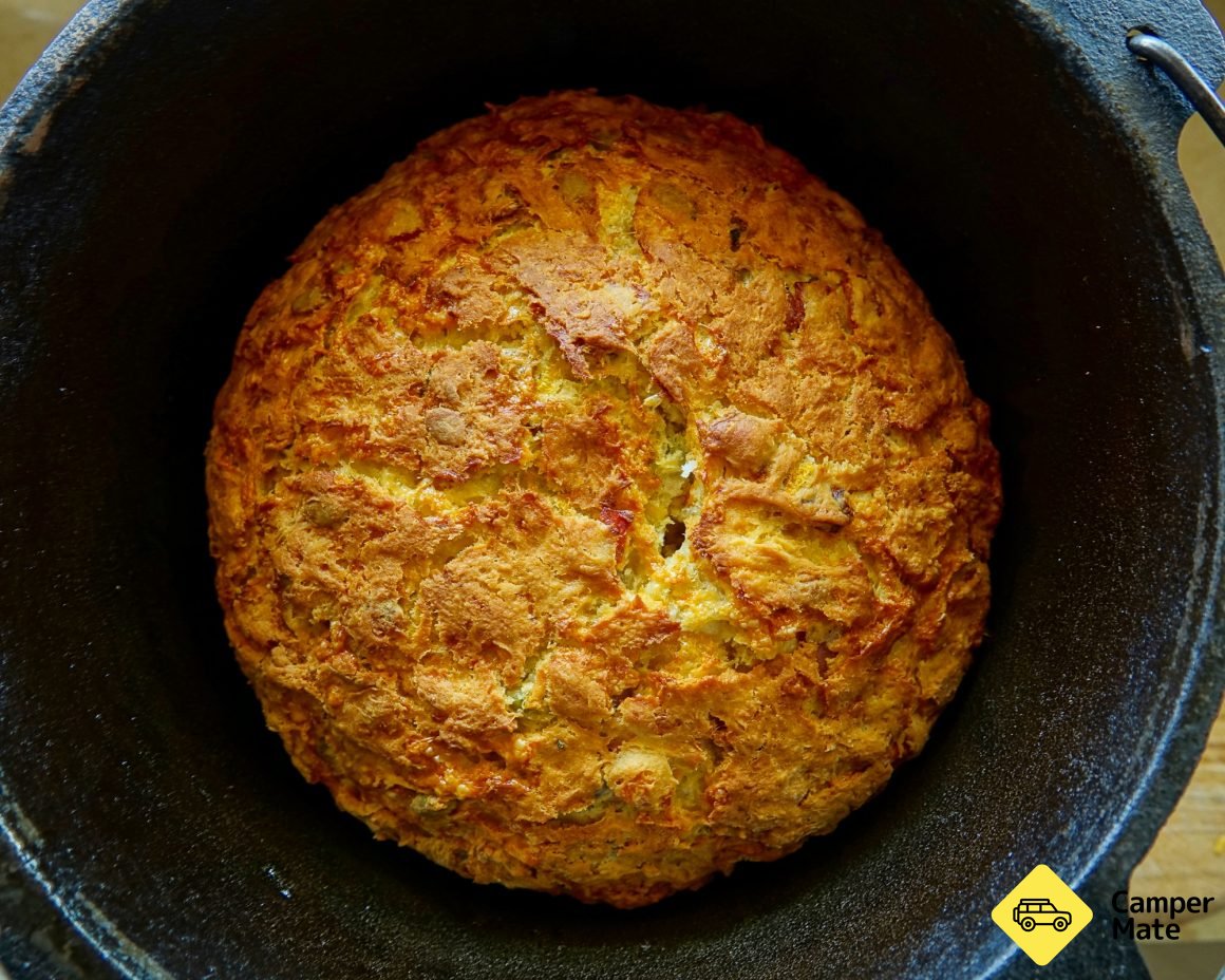 Cheesy pumpkin and bacon damper cooked in a cast iron pot